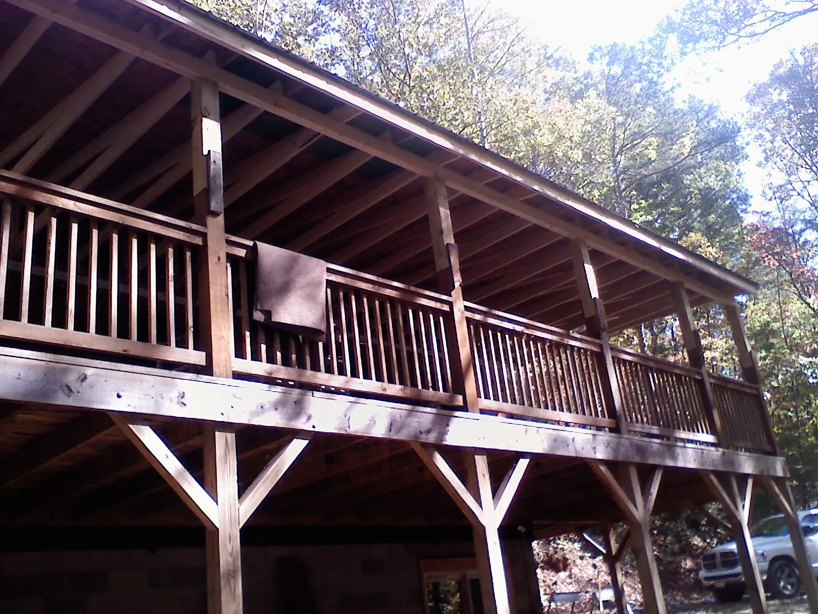 Timber framing under a new elevated porch and deck — Roof Leak Repair in Magazine by Roofing Brothers